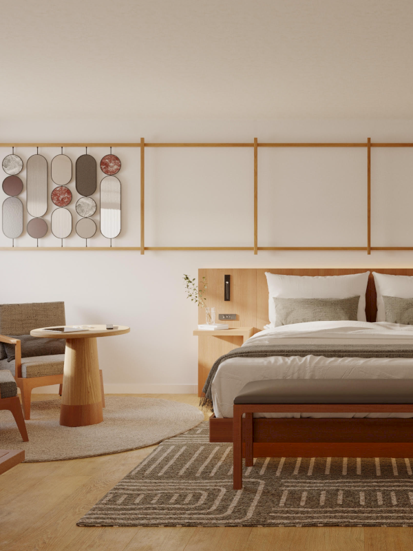 A modern bedroom with a wooden bed, a decorative wall piece, chairs, table, and a rug on wooden flooring.